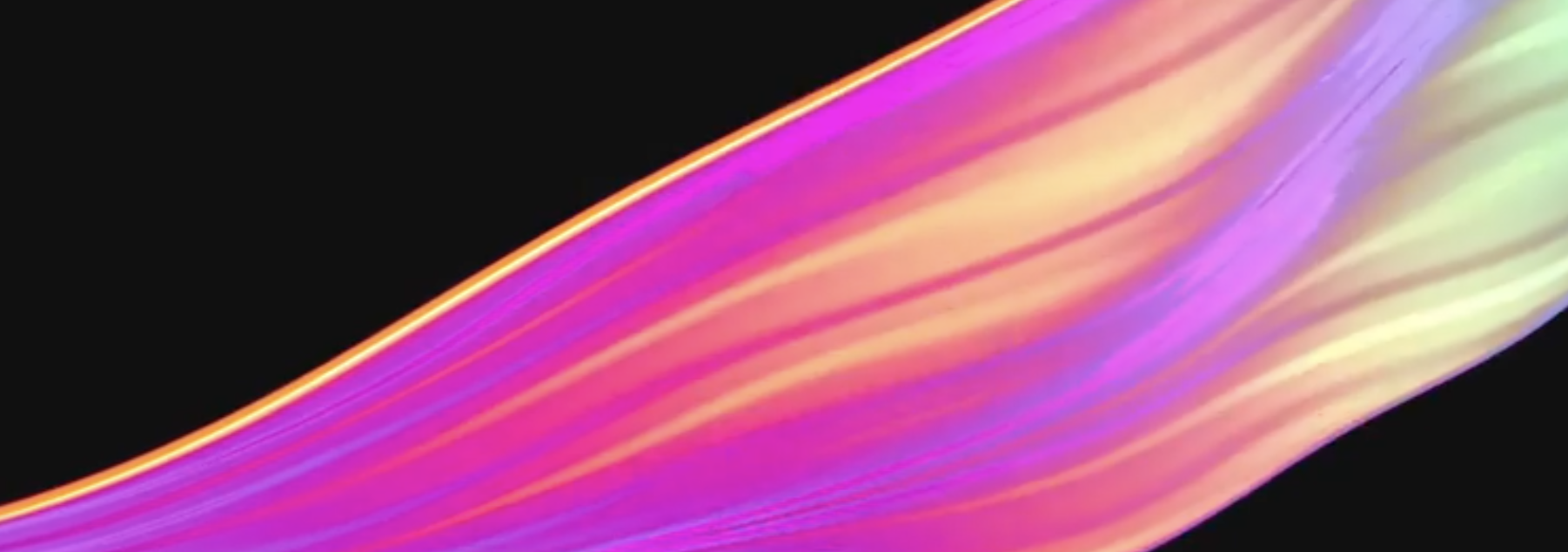 A bright wave of colour moving across a black field